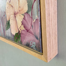 Load image into Gallery viewer, Girl in a bikini holding a surfboard standing in front of aqua blue water and palm trees. Detail view.