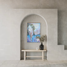 Load image into Gallery viewer, Girl in a bikini holding a surfboard standing in front of aqua blue water and palm trees. In situ in an arch.