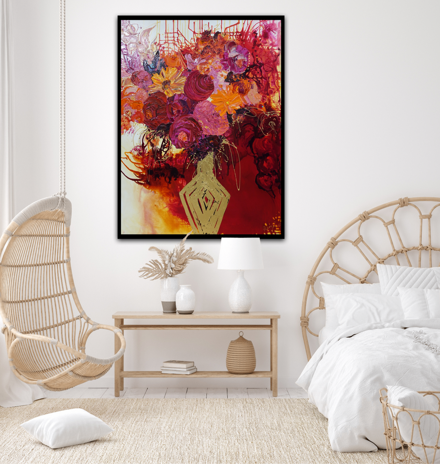 Gold vase with a mass of pink, red and orange blooms with red, gold and white background