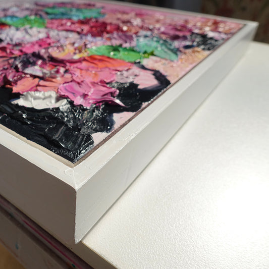 Cloase up view of an original painting of blooms in lollipop pastel shades.