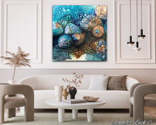 Load image into Gallery viewer, Rockpool shells in shades of turquoise, aqua and ochre. Shown in situ on a living room wall.