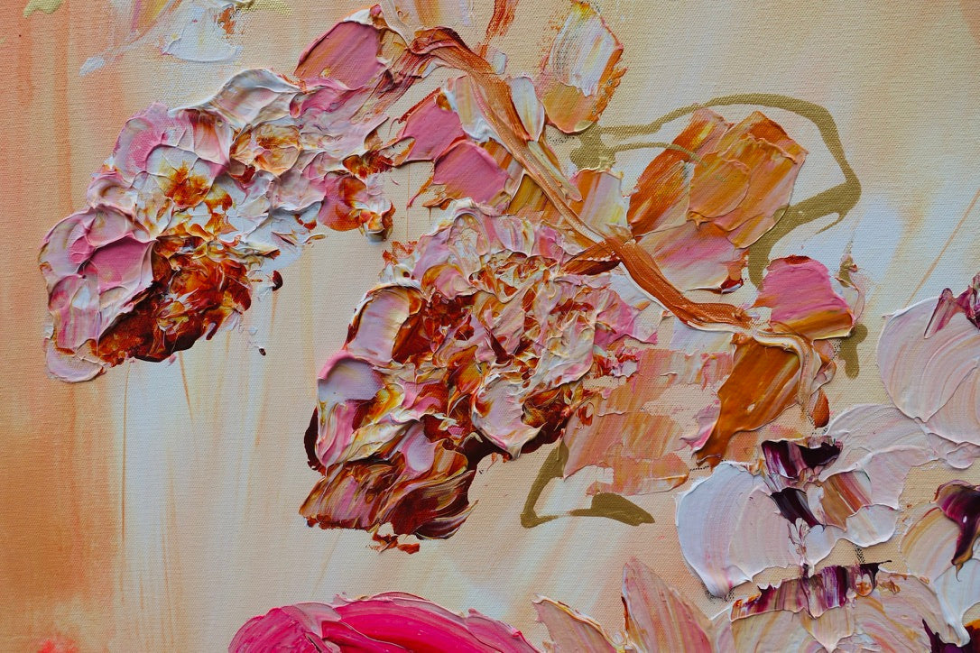 Abundance of blooms in pale pink, hot pink, burgundy and cream with splashes of bright orange on a pale apricot background. Detail view 3.