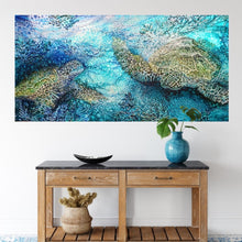 Load image into Gallery viewer, Painting of green sea turtles swimming in the ocean. Calming soothing colours in this painting in shades of blue, turquoise, aqua and green. Shown in situ on a white wall.