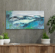 Load image into Gallery viewer, Abstract painting of distant hills in hues of aqua, turquoise, green and grey. In situ on a grey concrete wall.
