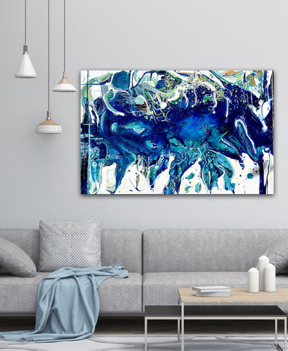 Abstract oil painting on a white background in shades of blue, white and green, on grey wall.
