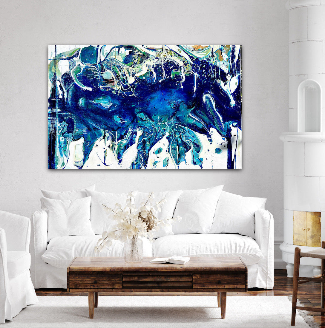 Abstract oil painting on a white background in shades of blue, white and green, on living room wall.