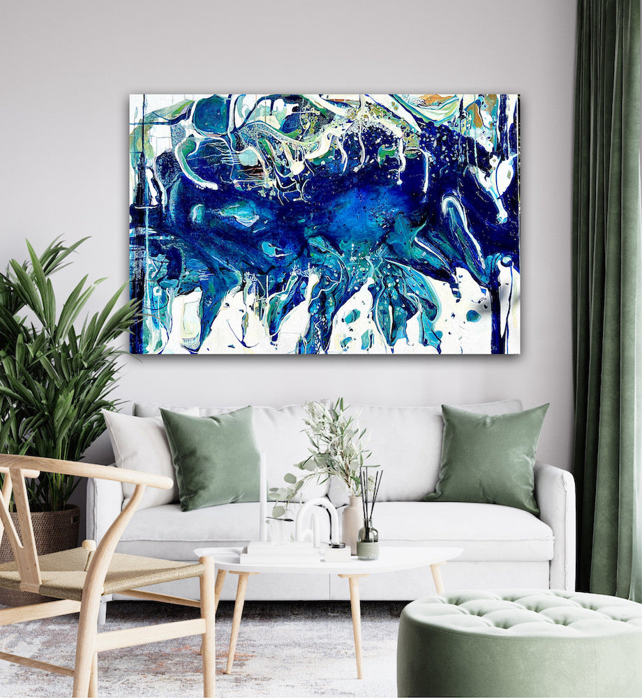 Abstract oil painting on a white background in shades of blue, white and green, shown on wall in living room.