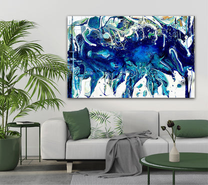 Abstract oil painting on a white background in shades of blue, white and green, on grey wall next to a palm.