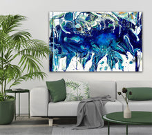 Load image into Gallery viewer, Abstract oil painting on a white background in shades of blue, white and green, on grey wall next to a palm.
