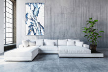 Load image into Gallery viewer, Abstract oil painting on a white background in light blue, mid blue and aqua with multicoloured detail. In situ on wall.
