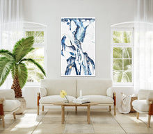 Load image into Gallery viewer, Abstract oil painting on a white background in light blue, mid blue and aqua with multicoloured detail. In situ on a beige wall.
