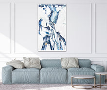 Load image into Gallery viewer, Abstract oil painting on a white background in light blue, mid blue and aqua with multicoloured detail. In situ on a white living room wall.

