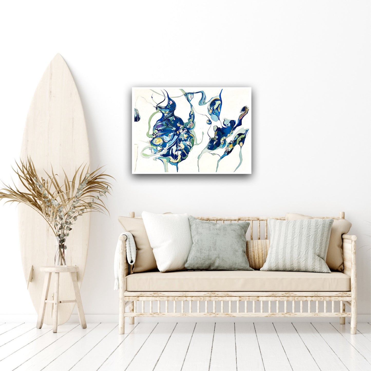Oil painting on a white background with two abstract shapes in shades of blue and green on wall in sitting room.