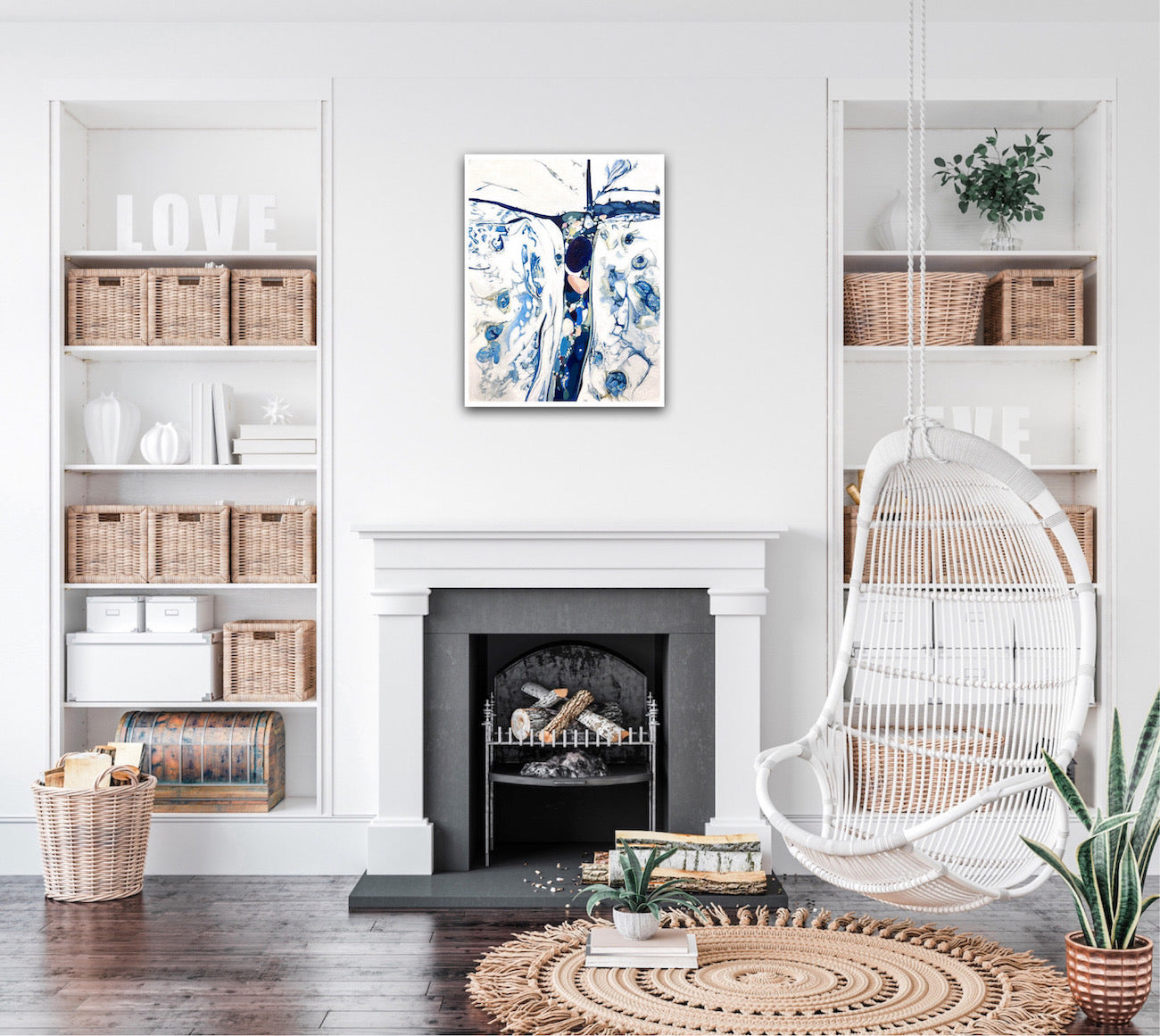 Abstract oil painting on a white background in shades of blue. Shown on a wall above a fireplace.