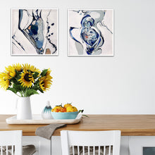 Load image into Gallery viewer, Small oil painting of a rockpool in an abstract style on a white background in shades of blue and multicoloured detail. In situ on a white wall with a matching painting.
