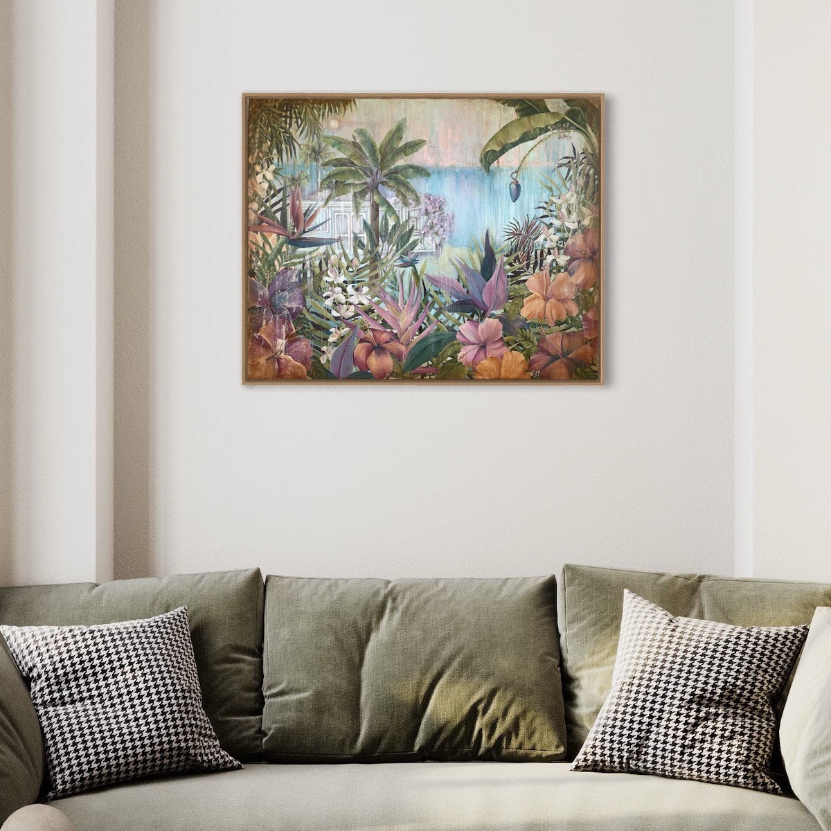 A beach shack in a tropical garden surrounded by lush palm trees and exotic flowers including pink hibiscus, orchids and birds of paradise. In situ on a white wall.