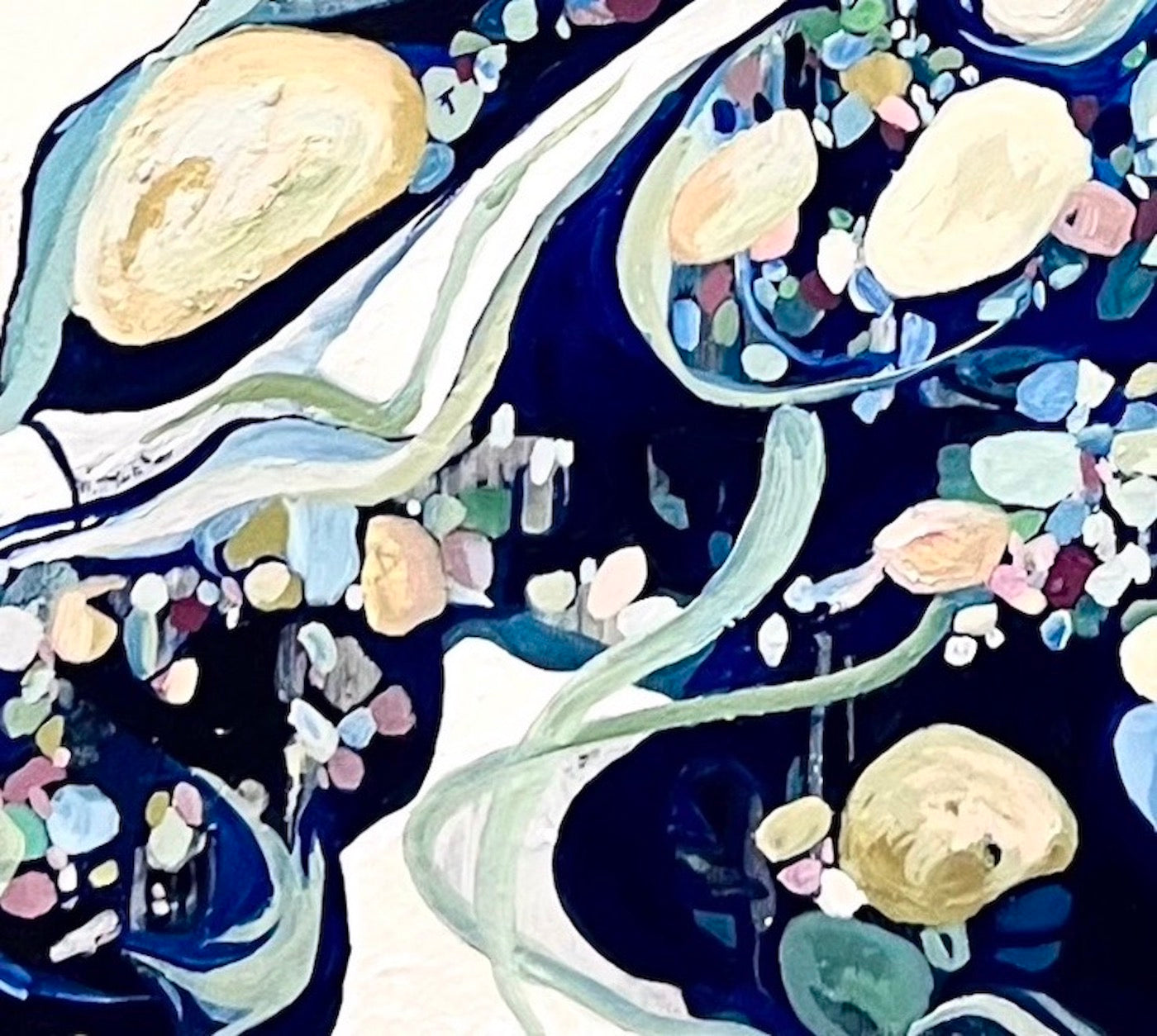 Abstract oil painting on a white background in shades of blue, cream and green with multicoloured detail. Close up view.