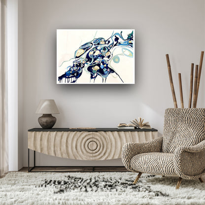 Abstract oil painting on a white background in shades of blue, cream and green with multicoloured detail, shown on a taupe coloured wall.