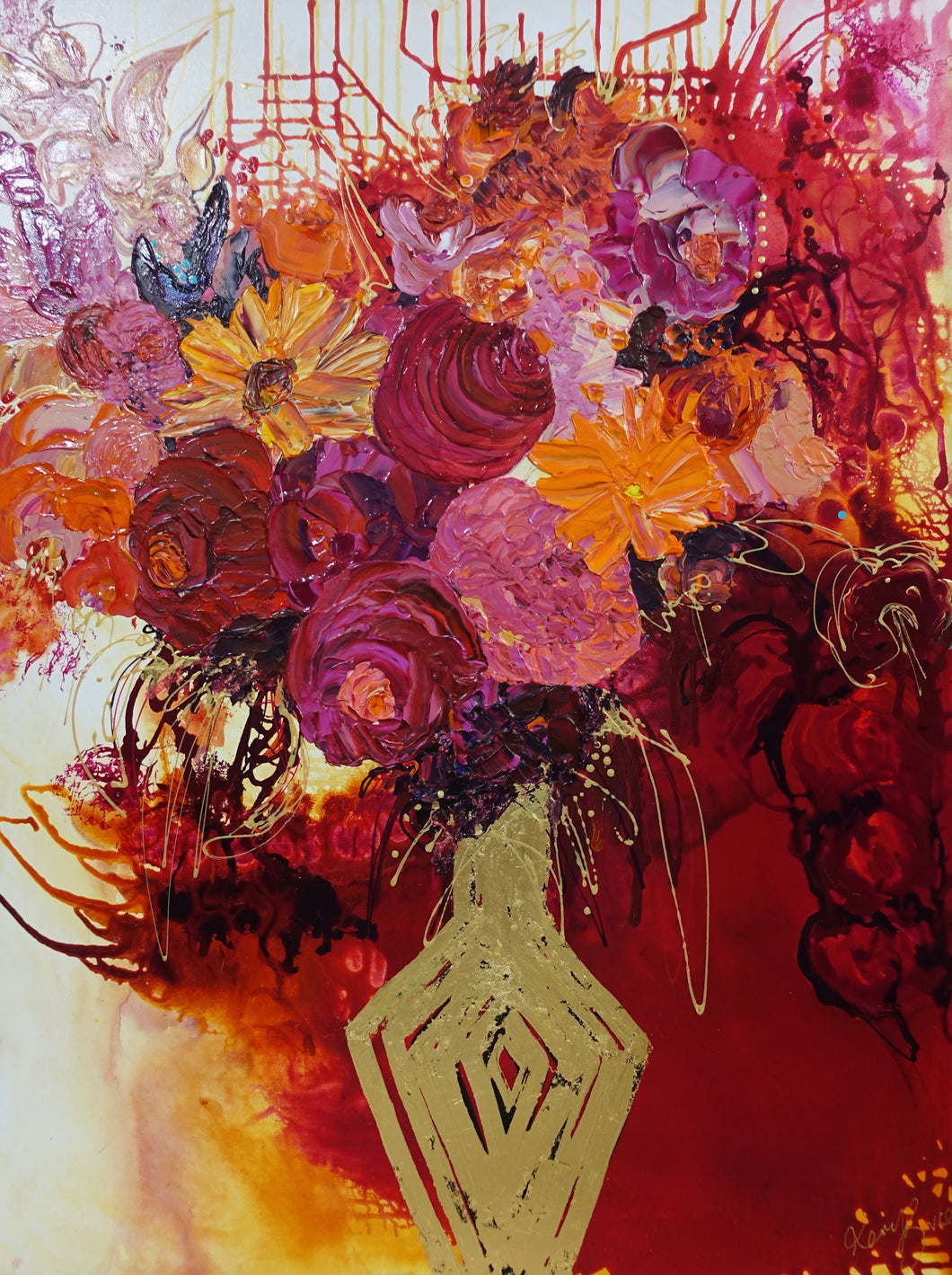 Gold vase with a mass of pink, red and orange blooms with red, gold  and white background