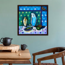 Load image into Gallery viewer, Painting of a budgerigar in front of a plate of kiwi fruit. Shown in situ in a dining room.
