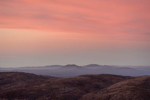 A soft alpine sunrise dusts the rolling peaks of 
Kosciuszko National Park, Australia