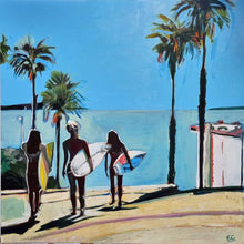 Load image into Gallery viewer, Three girls, with surfboards under their arms, heading towards the ocean for a surf, down a path lined with palm trees. There is a headland in the distance, across the water.

