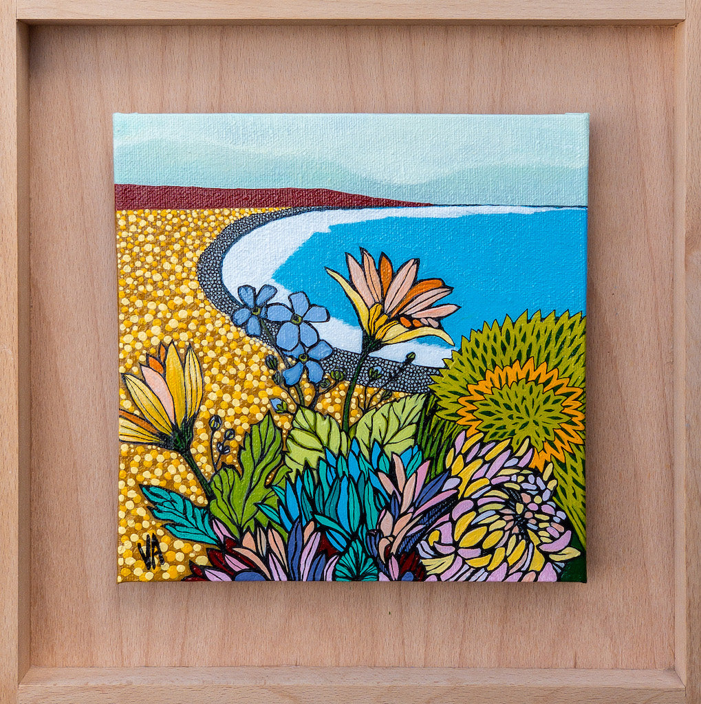 A colourful painting of bright blooms by the sea.