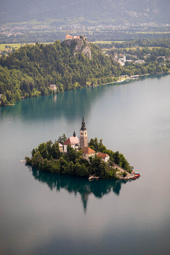 The Church of Mary the Queen, perched as in
a fairy tale in the middle of Lake Bled. Slovenia 