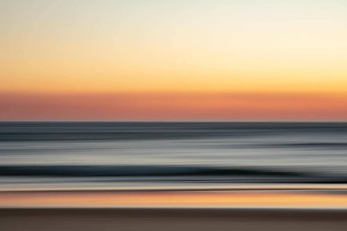 The warm tones of pre-dawn over a typical
South Coast beach. Meroo Head, Australia 