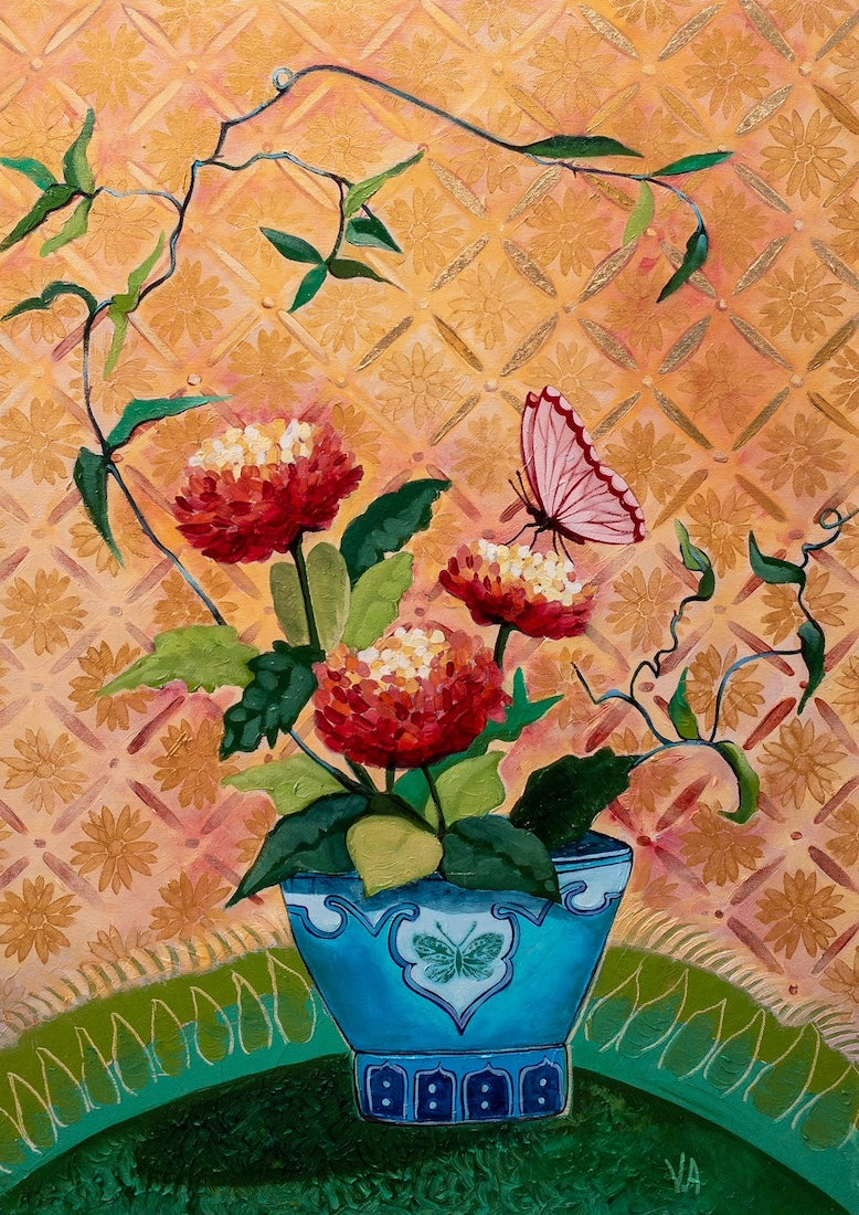 Potted plant with red blooms and climbing branches and a pinkish red butterfly on one of the blooms. In a royal blue pot, standing on an emerald green tray against a pale orange and beige pink diamond patterned wallpaper.