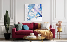 Load image into Gallery viewer, Abstract rock pool painting in shades of blue, white aqua turquoise and mauve.  Shown in situ on a white wall above a red sofa.
