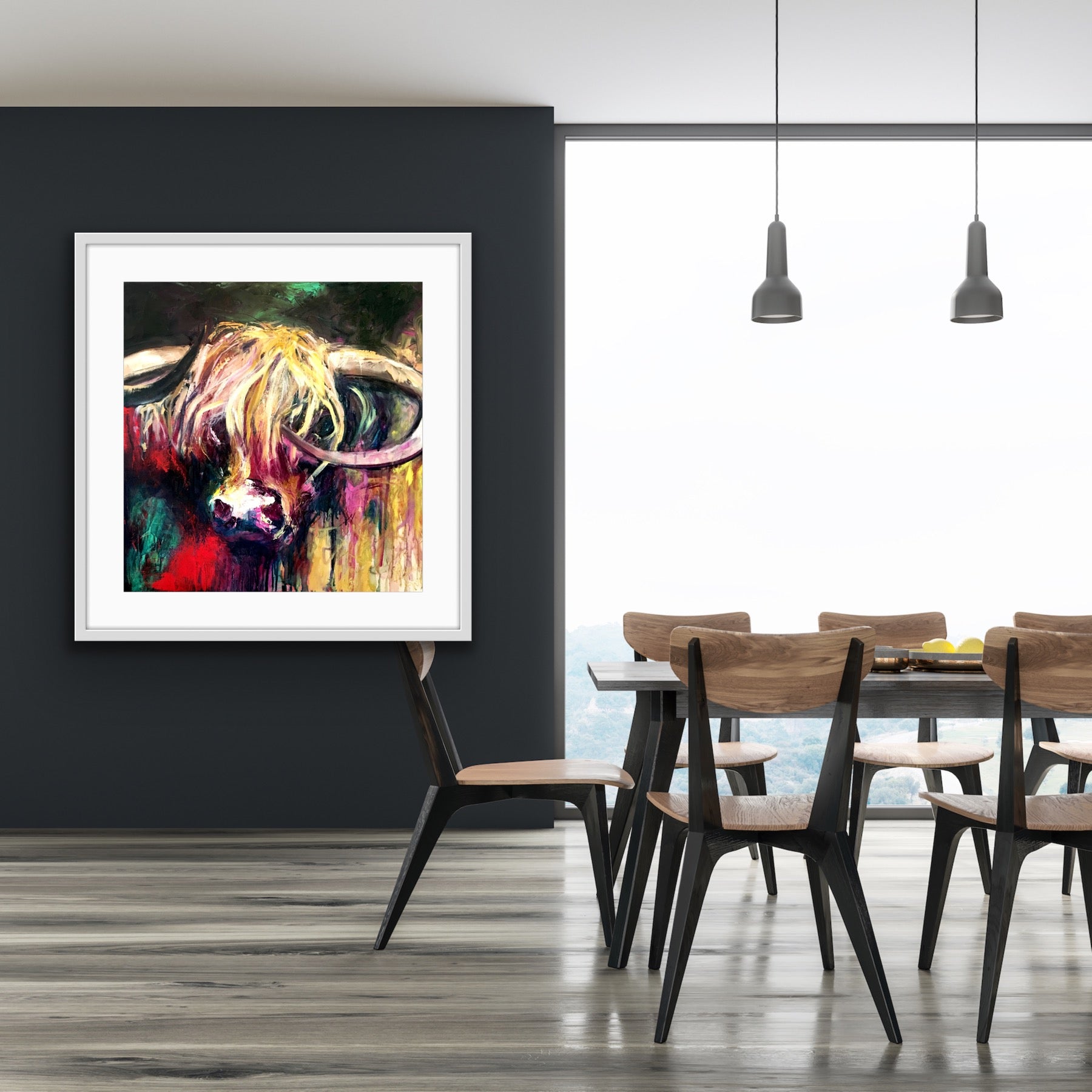 A lovely limited edition print of Curly the bull with his head against a background of emerald, red, gold, pink and black, in a white frame.