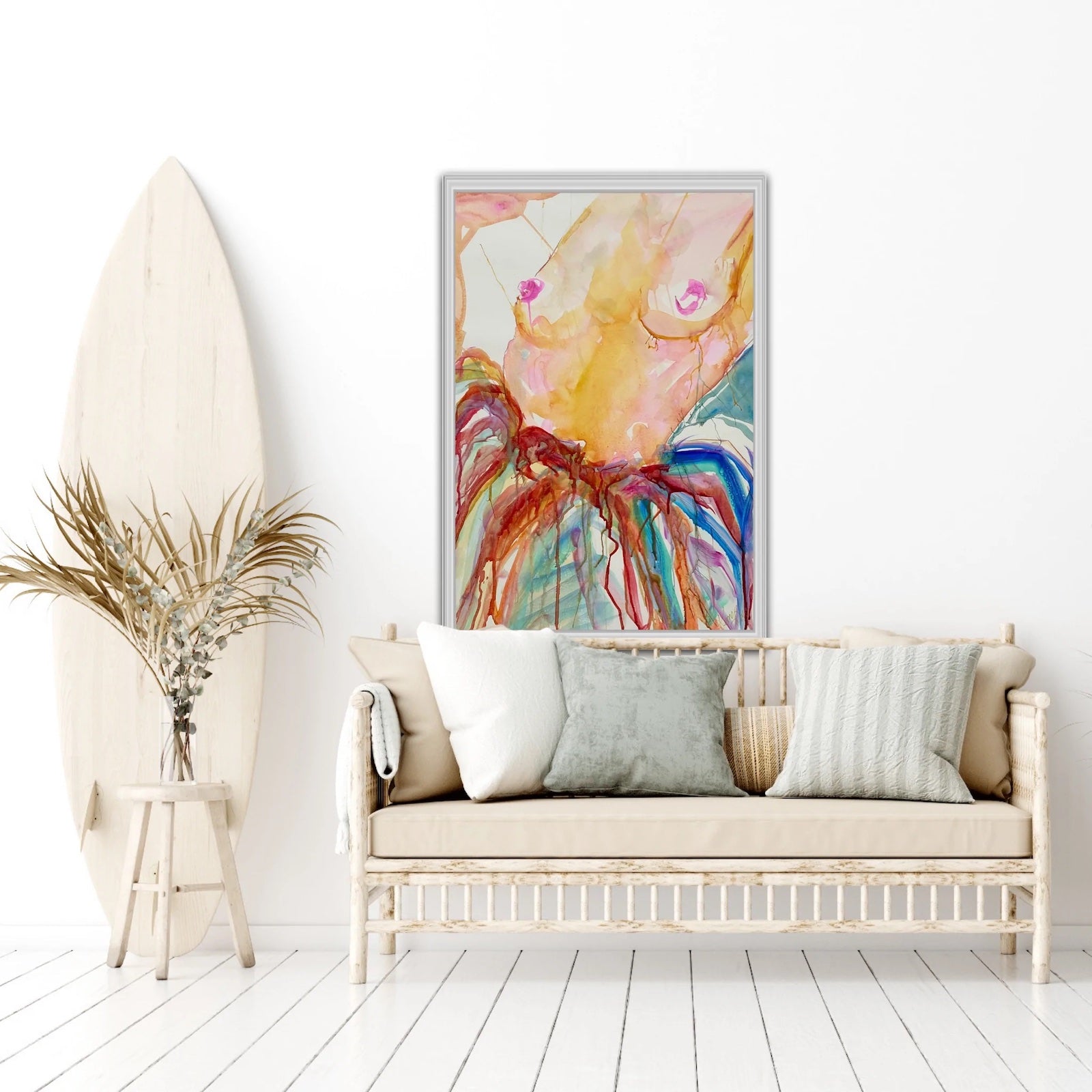 Woman nude from the waist up and wearing a multi coloured skirt. In situ on a white wall.