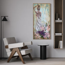Load image into Gallery viewer, Back view of a woman holding a sheet and her arm up to her hair with tropical flowers in the foreground. In situ on a sitting room wall.
