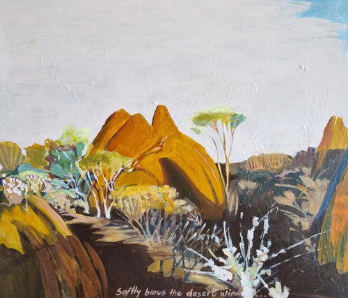 A desert scene with a rocky outcrop and desert trees.