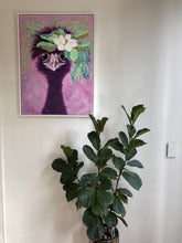 Load image into Gallery viewer, Fun painting of a female emu with a floral headdress made of a magnolia flower against a pink, purple background. Shown in situ on a white wall above a potted fiddle leaf fig.
