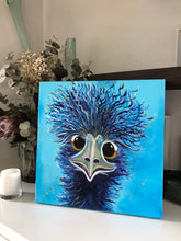 Load image into Gallery viewer, An emu&#39;s face with crazy hair sticking sticking straight up. The emu is painted royal blue against an aqua background. Shown in situ on a white shelf.
