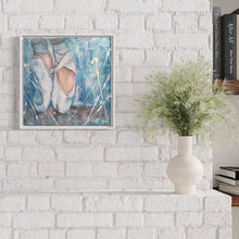 Load image into Gallery viewer, Pair of ballet shoes with ballerina standing en pointe.  In situ on a white brick wall.
