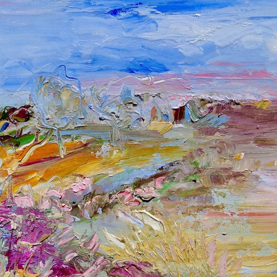 Abstract painting of a field in shades of pink, orange, green and yellow against a blue sky. Square view.