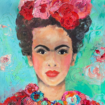 A beautiful and colourful limited edition print of Frida Kahlo with red and pink flowers in Frida's hair against a turquoise and aqua background.