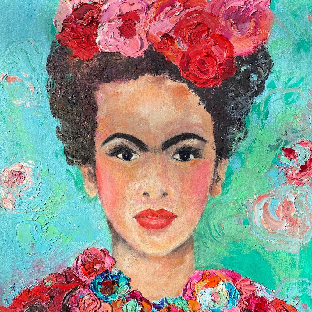 A beautiful and colourful limited edition print of Frida Kahlo with red and pink flowers in Frida's hair against a turquoise and aqua background.