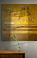 Load image into Gallery viewer, An abstract painting in a golden hue with geometric lines and light streaming through the clouds. Next to the clouds is a crown. A portion of the painting is shown here on a white wall. In front of the painting is a clear glass vase with a single red tulip.
