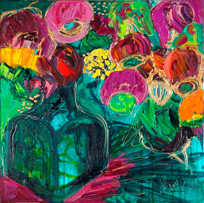 A magnificent bunch of vibrant blooms in a turquoise glass vase against a turquoise, green and magenta background.