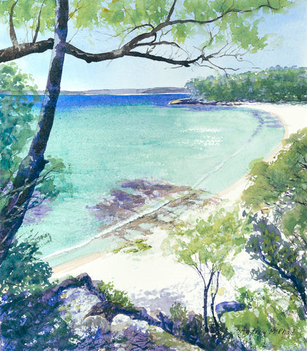 Jervis Bay in the early morning, showing rocks, white sand and emerald ocean.