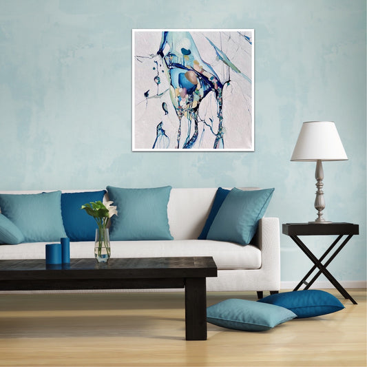 Abstract painting with a background of mostly white with blues and multi coloured detail. Shown on pale blue living room wall.