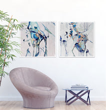 Load image into Gallery viewer, Abstract painting with a background of mostly white with blues and multi coloured detail. Shown on a white wall next to a matching artwork.
