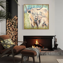 Load image into Gallery viewer, Highland cow mother and calf in pastel coloured grass and blue sky. In situ above a fireplace.
