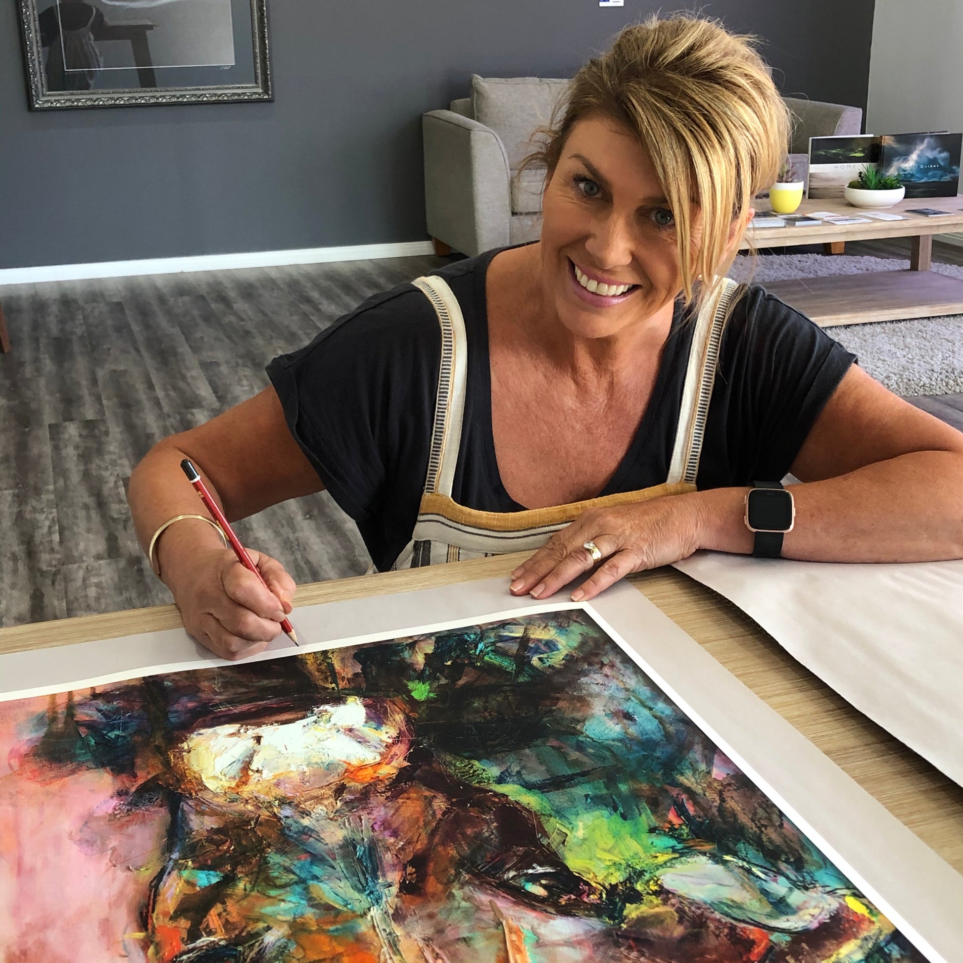 Artist Kerry Bruce signing a copy of a gorgeous limited edition print of Dairy Queen the cow. 