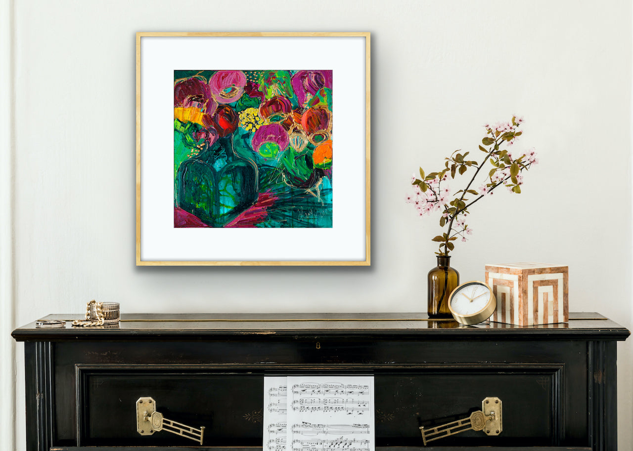 A magnificent limited edition print of a bunch of vibrant blooms in a turquoise glass vase against a turquoise, green and magenta background, framed in Tasmanian Oak.