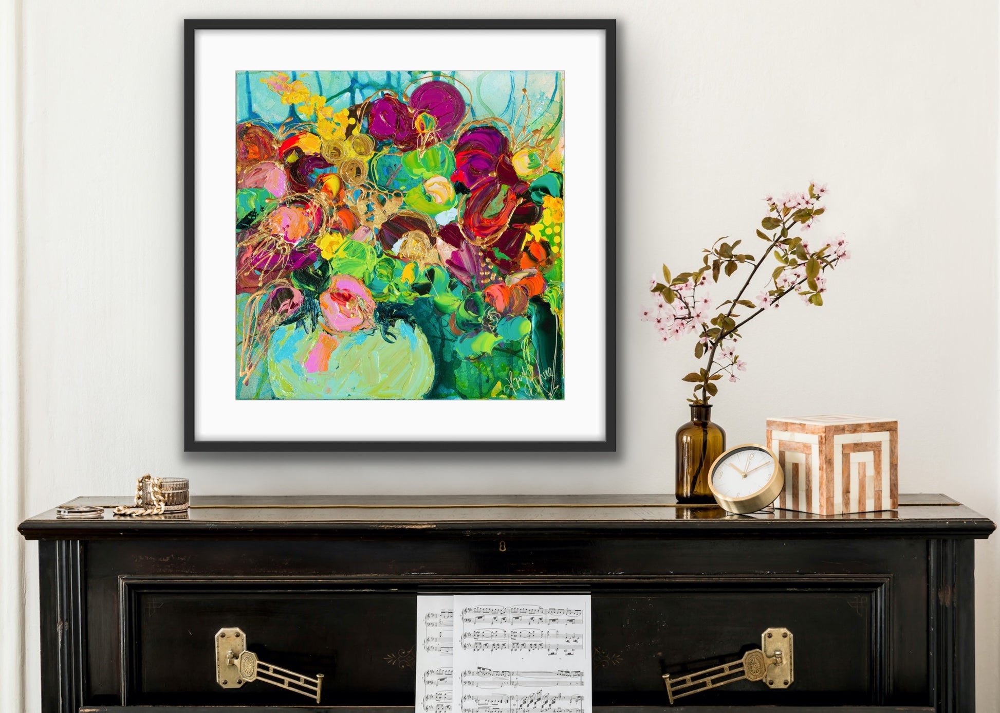 Limited edition print of a mass of gorgeous blooms in shades of green, pink, magenta, red and gold in a green glass vase.